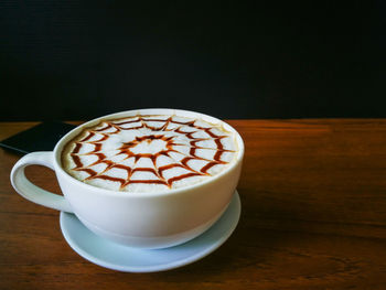 Close-up of cappuccino on table