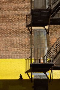 Brick wall with fire staircases 