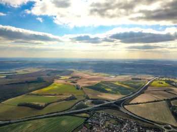 Aerial view of agricultural field against sky