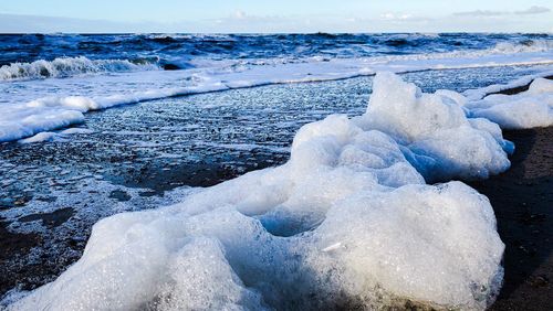 Snow on sea shore