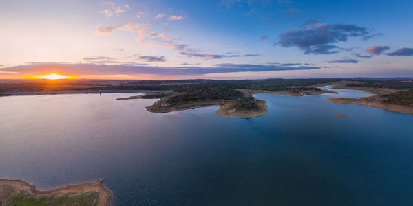 Drone panoramic aerial view of minutos dam in arraiolos alentejo at sunset, portugal