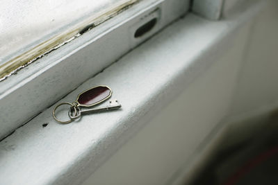 High angle view of key on window sill