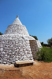 Low angle view of castle against clear blue sky