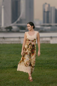 Young woman standing on field