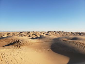 Scenic view of desert against clear sky