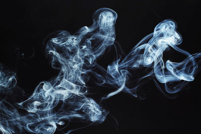 Close-up of smoke against black background