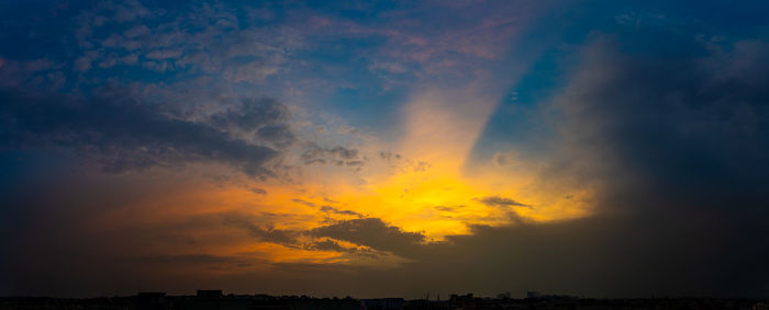 Low angle view of dramatic sky during sunset