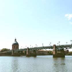 Bridge over river against clear sky