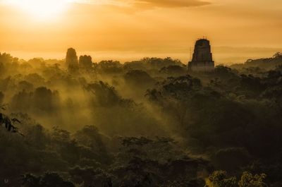 Panoramic view of temple against sky during sunset