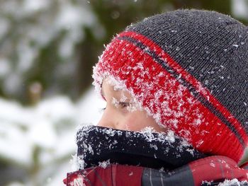 Close-up of boy wearing knit hat during winter