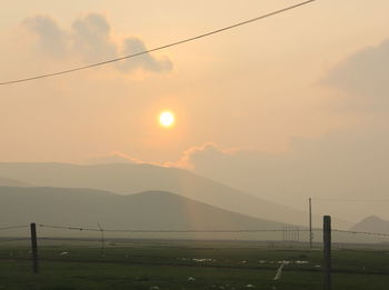 Scenic view of mountains against sky during sunset