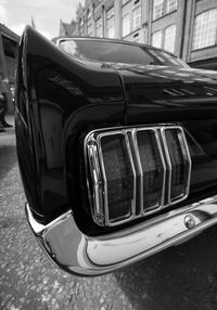 Close-up of vintage car parked on road