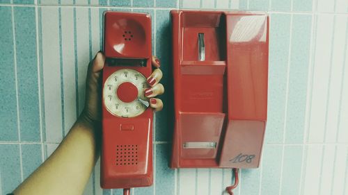 Close-up of human hand holding telephone