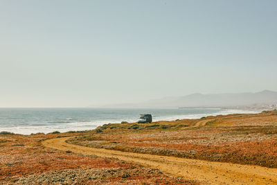 Camper van parked on deserted beach in baja, mexico.