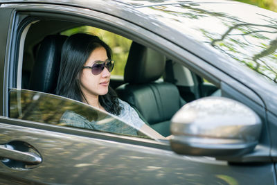 Portrait of woman in car