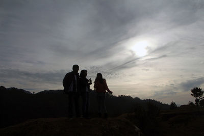 Silhouette of people on landscape