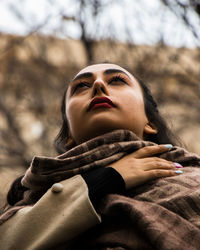 Portrait of young woman looking away