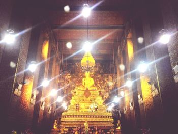 Low angle view of illuminated building at night