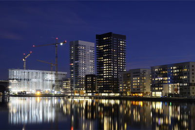 Illuminated buildings in city at night