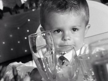 Boy by glasses looking away