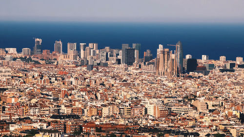 High angle view of city buildings against sky