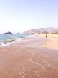 Scenic view of beach against clear sky