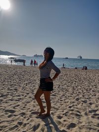 Full length of man on beach against sky