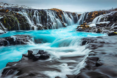 Scenic view of waterfall during winter