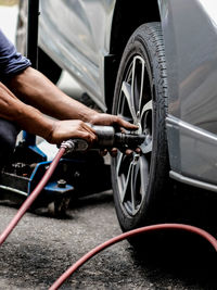 Low section of man washing car