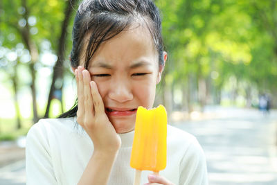 Portrait of woman eating food