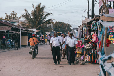 People walking on street in city