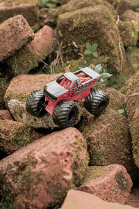 Close-up of tough toy car on difficult terrain