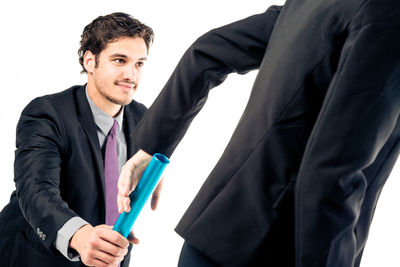 Low angle view of man working against white background