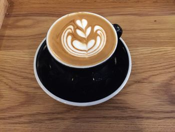 High angle view of cappuccino on table