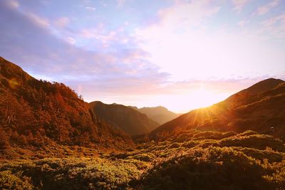 Scenic view of mountains against sky during sunset