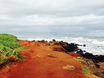 Scenic view of sea against cloudy sky