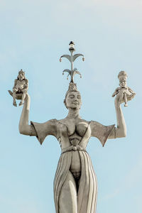 Low angle view of statue against sky