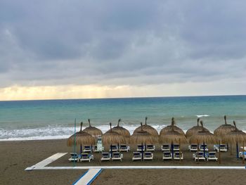 Built structure on beach against sky