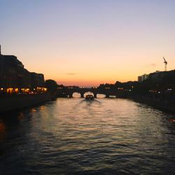 Bridge over river at dusk