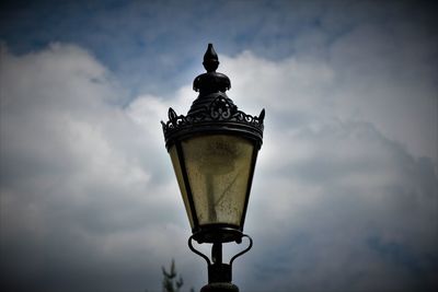 Low angle view of street light against sky