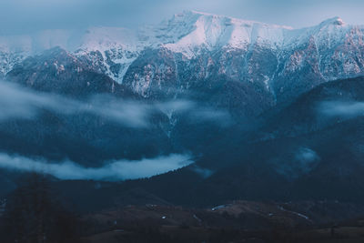 Scenic view of snowcapped mountains against sky