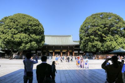 People at town square against clear sky