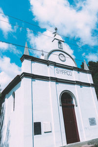 Low angle view of bell tower against sky