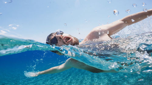 Man swimming in sea