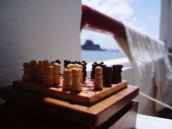 Close-up of chess on table at balcony