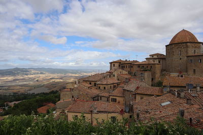 Houses against sky in town