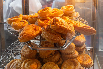 Showcase with puff pastry in a street shop. photo with shallow depth of focus