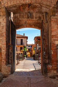 Alley amidst buildings in city