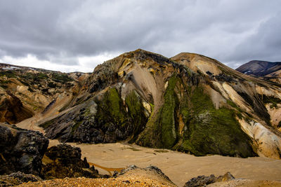 Panoramic view of rocky mountains against sky