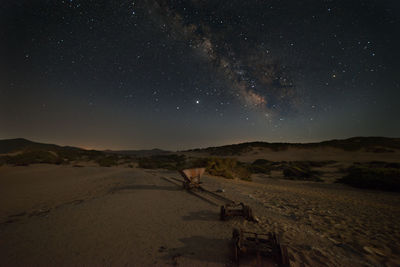 Scenic view of land against sky at night